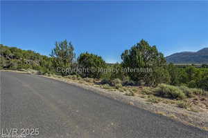 View of asphalt street with a mountain view