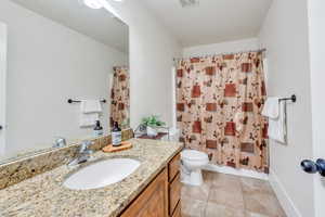 Bathroom featuring vanity and tile patterned floors
