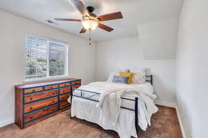 Bedroom with carpet flooring and a ceiling fan