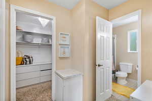 Primary Bedroom Walk-in Closet & Bathroom