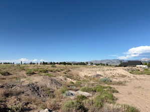 View of undeveloped land featuring rural landscape and a mountainous background
