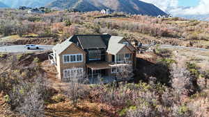 Rear view of property with a patio area and a mountain view