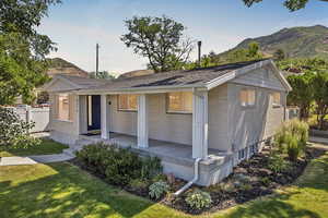 View of front of home with a mountain view and brick siding