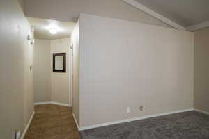 Tiled spare room with baseboards and a textured ceiling
