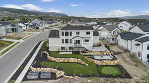 Aerial perspective of suburban area with a mountainous background