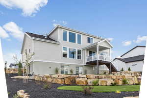 Rear view of house with stairs