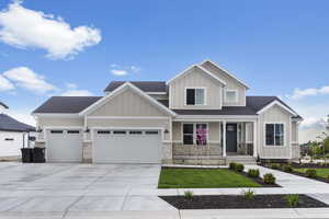Craftsman-style house with a porch, an attached garage, concrete driveway, and a shingled roof