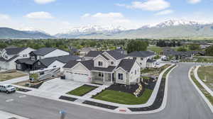 Aerial view of residential area featuring a mountainous background