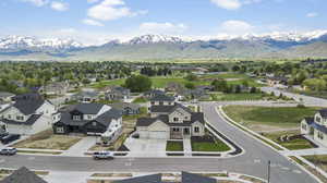 Aerial perspective of suburban area featuring a mountain backdrop