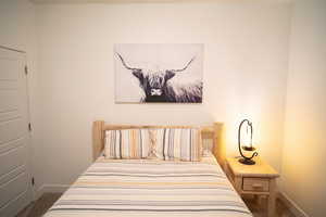 Carpeted bedroom with baseboards