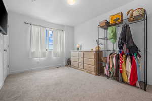 Bedroom with carpet and baseboards