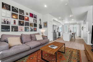 Living room featuring light wood-style floors and recessed lighting