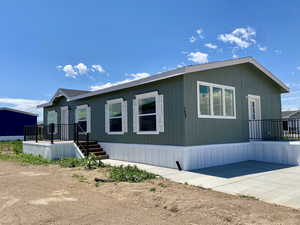 View of front of house with a patio area