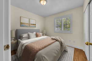 Bedroom featuring a closet and wood finished floors