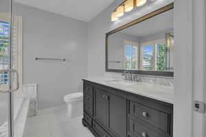 Bathroom featuring vanity and tile patterned flooring