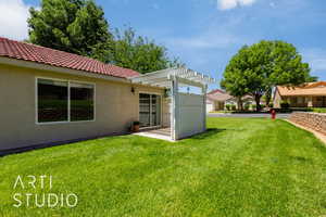 View of green lawn featuring a pergola