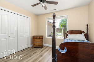 Bedroom with light wood-style flooring, a closet, baseboards, and ceiling fan
