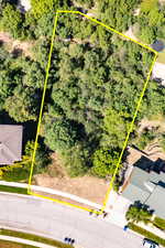 Aerial view of property and surrounding area with property boundaries highlighted