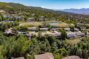 Aerial perspective of suburban area with a mountain backdrop