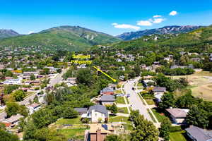 Aerial view of residential area featuring a mountain backdrop