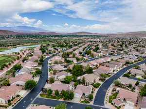 Aerial perspective of suburban area with a water and mountain view