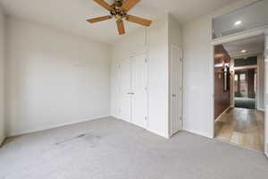 Unfurnished bedroom featuring carpet, a closet, ceiling fan, and recessed lighting