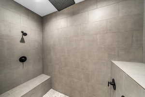 Full bath with a tile shower