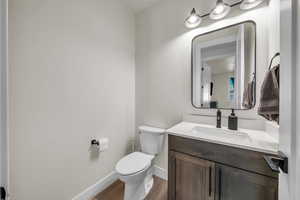 Bathroom with vanity and wood finished floors