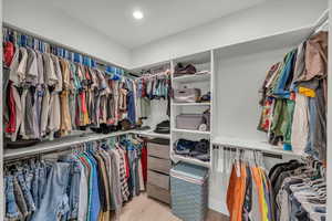 Spacious closet featuring wood finished floors