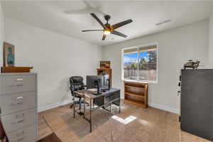 Office with a ceiling fan and wood finished floors