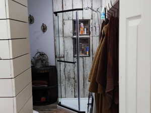 Mudroom featuring wood finished floors and a textured ceiling