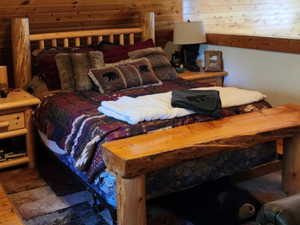Bedroom with wood finished floors and ceiling fan