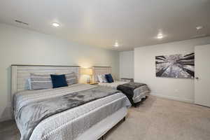 Large basement bedroom with two queen sized beds