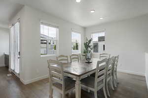 Dining space with large windows and natural lighting