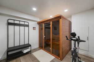 Exercise area with spin bike and infrared sauna