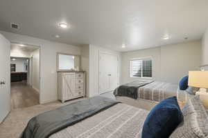 Large basement bedroom with two queen size beds
