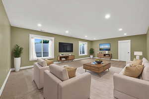 Virtually staged basement living area featuring plenty of natural light and recessed lighting
