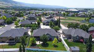 Aerial perspective of suburban area featuring a mountain backdrop