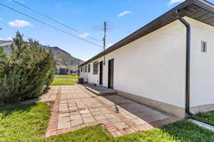 View of yard with a patio area and a mountain view
