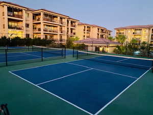 View of tennis court featuring community basketball court