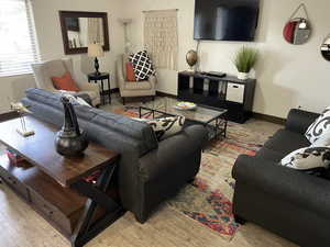 Living area featuring light wood-style floors