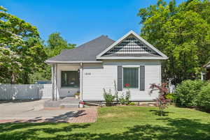 View of front of property featuring a shingled roof