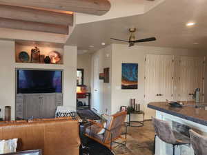 Living room featuring ceiling fan and recessed lighting