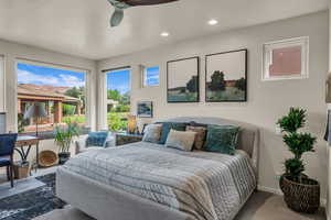 Carpeted bedroom with recessed lighting and ceiling fan