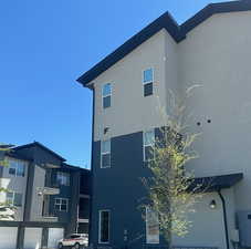 View of property exterior with stucco siding