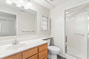 Bathroom with vanity and a stall shower