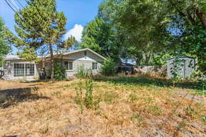 View of yard with a storage shed