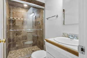 Bathroom featuring vanity and a stall shower