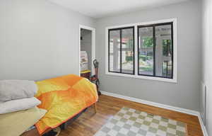Bedroom featuring a closet and light wood-style flooring
