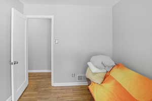 Living area with light wood-type flooring and baseboards